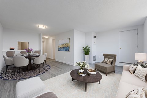 a living room and dining room with a table and chairs